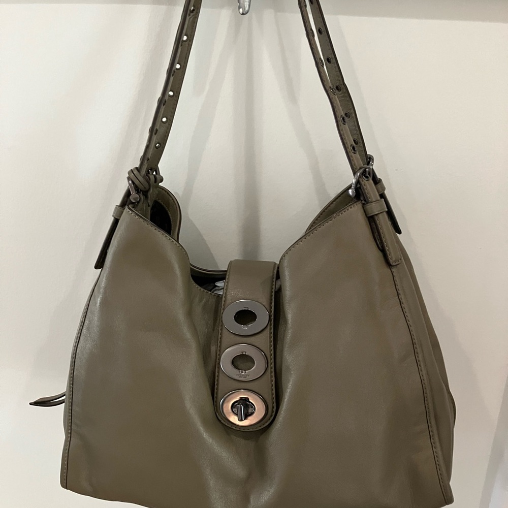 Coach Edie bag with 3 turn lock adjustable closures